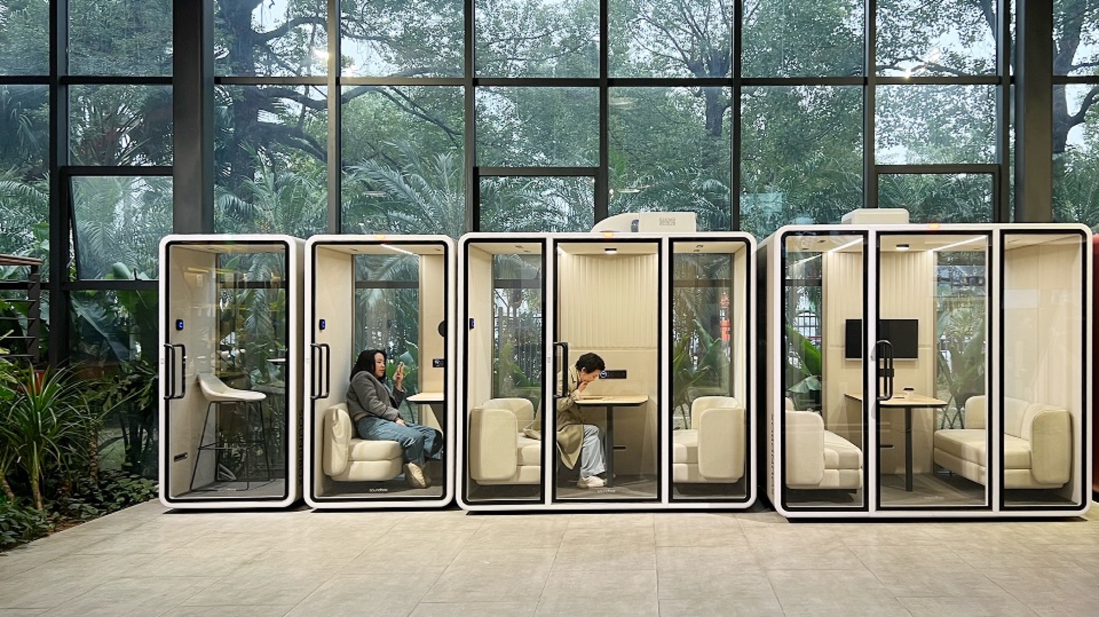 The ZOUND showroom — pods in a calm, plant-filled gallery